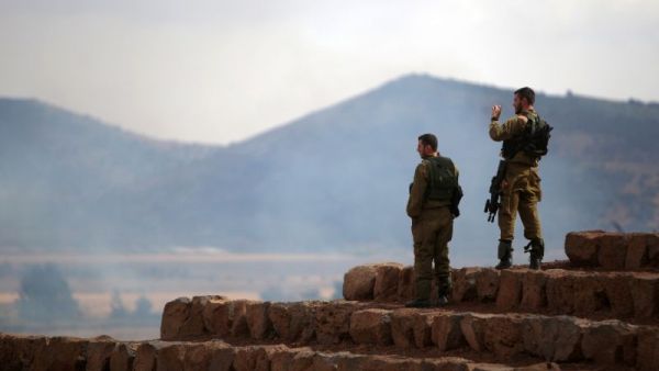 Israeli soldiers in the Israeli-occupied Golan Heights on June 28, 2015. (AFP/File) Israeli soldiers in the Israeli-occupied Golan Heights on June 28, 2015. (AFP/File)