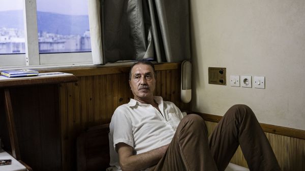 Moufid in his hotel room in Athens. (AFP)