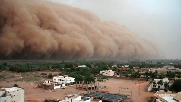 A haboob, similar to the one that swept over small-town Lubbock, Texas on Sunday, is seen over Khartoum. Intense dust storms caused by downward-flowing winds from thunderstorms, haboobs are common in the American southwest and parts of the Middle East.  (AFP/File).  