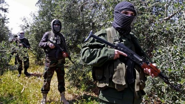 Hezbollah fighters are seen in Syria, where the group is supporting the al-Assad government against various rebel groups. (File photo)