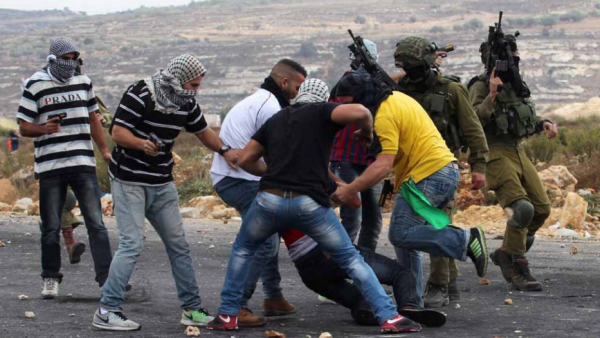 Undercover Israeli forces detain a Palestinian stone thrower near Ramallah in early October. (AFP/File)