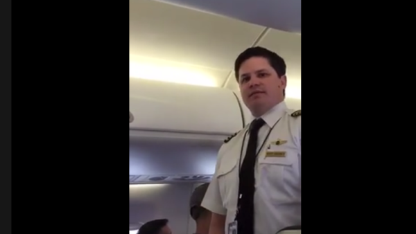 An screengrab from the video apparently filmed on a United Airlines flight in Chicago on March. 20. (photo: Facebook/ Eaman-Amy Saad Shebley)