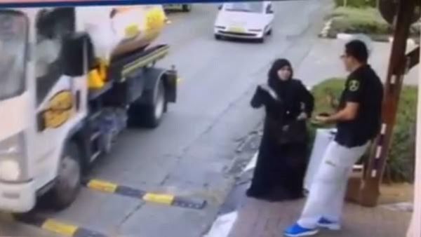 A screenshot from a video showing a Palestinian woman attacking an Israeli policeman in the West Bank in November.