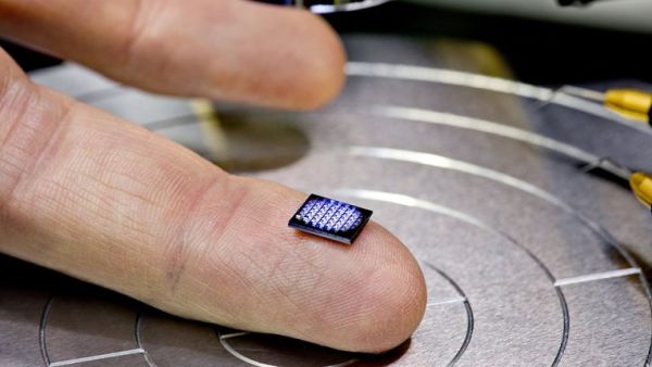 The chip is so tiny you’ll need a microscope to see it. (Photo: IBM)