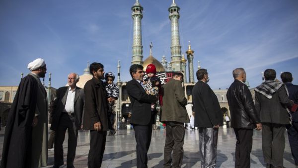 Iranians line up outside a polling station at Massoumeh shrine during the parliamentary elections at a polling station in the city of Qom, 130km south of the capital Tehran, on Feb. 26, 2016. (AFP/Behrouz Mehri) Iranians line up outside a polling station at Massoumeh shrine during the parliamentary elections at a polling station in the city of Qom, 130km south of the capital Tehran, on Feb. 26, 2016. (AFP/Behrouz Mehri)