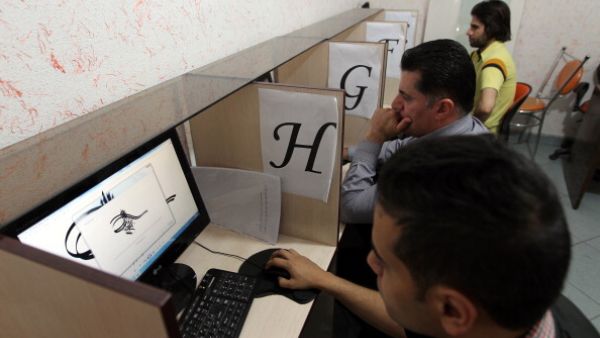 Iranians use an internet cafe in the capital Tehran.  (AFP/Atta Kenare)