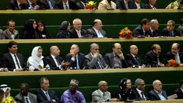 RAN, Tehran : Foreign guests attend the swearing-in ceremony of Iran's new president Hasan Rowhani at the parliament in Tehran on August 4, 2013. The Islamic republic's new president revealed a cabinet lineup of experienced technocrats, aiming to deliver on his promise of saving the economy and engaging the world. AFP PHOTO/ATTA KENARE