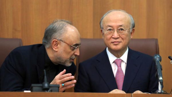 Head of Iran's Atomic Energy Organisation Ali Akbar Salehi (L) and International Atomic Energy Agency (IAEA) Director General Yukiya Amano, take part in a press conference in Tehran. (Image credit: AFP)