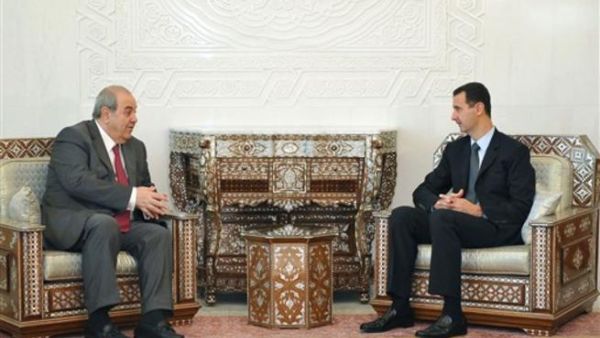 الرئيس السوري مستقبلا اياد علاوي-ا.ف.ب