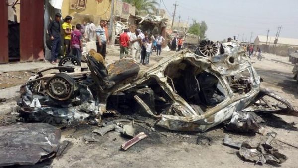 Aftermath of a car bombing in al-Obaidi neighborhood, east of Baghdad (AFP/ Ali Al-Saadi)