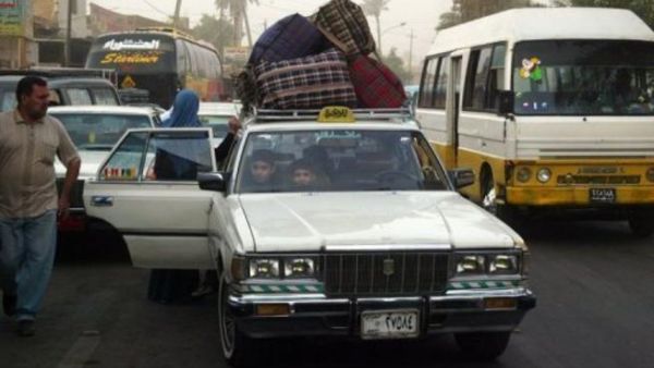 عائلة عراقية لاجئة بعد عودتها الى بغداد قادمة من دمشق
