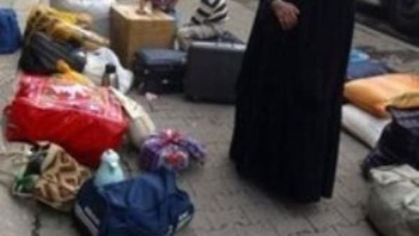 ارشيف: لاجئة عراقية لدى عودتها الى بغداد عام 2008