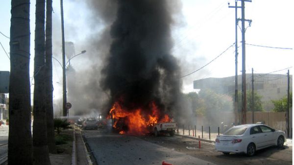 Flames rise from the site of a car bomb attack in the northern Iraqi city of Kirkuk. (Image Credit: AFP)