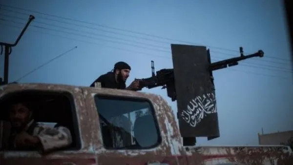 The group's leader, Zahran Alloush, demanded that the Syrian government stop their offensive in Ghouta or else the militant group will retaliate. (AFP/File)