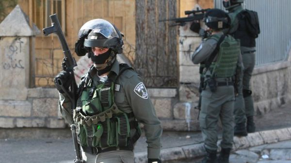Israeli border guards keep position during clashes with Palestinian youths following a protest over the rights of Palestinian prisoners held in Israeli jails, on February 05, 2016. (AFP/Musa al Shaer)