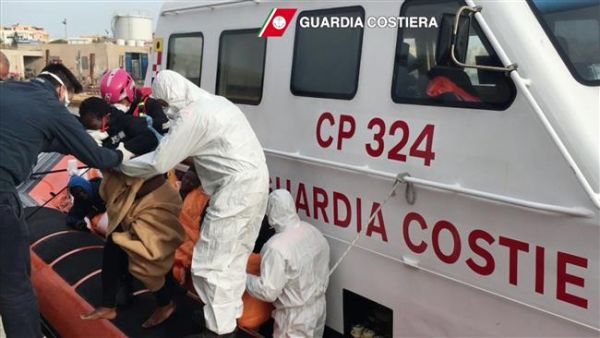 In this handout video capture released by the Italian Coast Guard on April 30, 2016, refugees arrive at Lampedusa harbor after a rescue operation at sea, off the coast of Libya. (AFP/File)