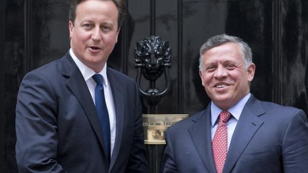 British Prime Minister David Cameron (L) greets Jordan's King Abdullah II at Number 10 Downing Street in central London on June 19 (Justin Tallis / AFP)