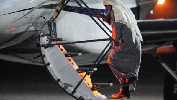 Radical Islamist cleric Abu Qatada boarding a privately chartered jet at the RAF Northolt base in west London, early on July 7, 2013, as he gets deported to Jordan.(AFP / MOD Crown Copyright)