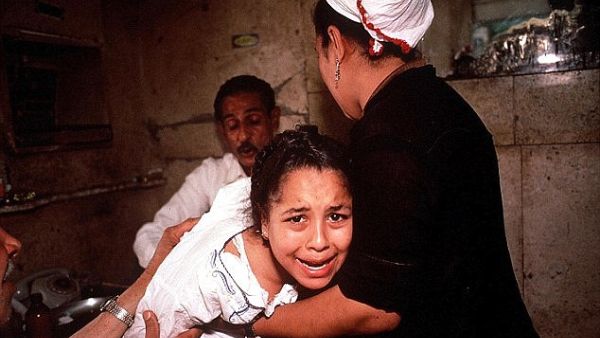 Up to 92 per cent of married women in Egypt have undergone female genital mutilation, it has been revealed. A young girl is pictured above undergoing FGM in Egypt in 1987. (Daily Mail)