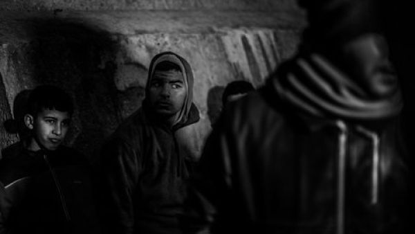 Moroccan boys on the breakwater next to Melilla’s harbor. Jan. 15, 2014. (José Colón/MeMo)