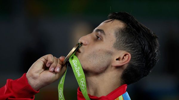 Ahmad Abughaush kisses the gold medal he won for Jordan in the 2016 Olympics in RioTaekwondo PHOTO: Salem Khamis (Photo credit: Wikimedia Commons).