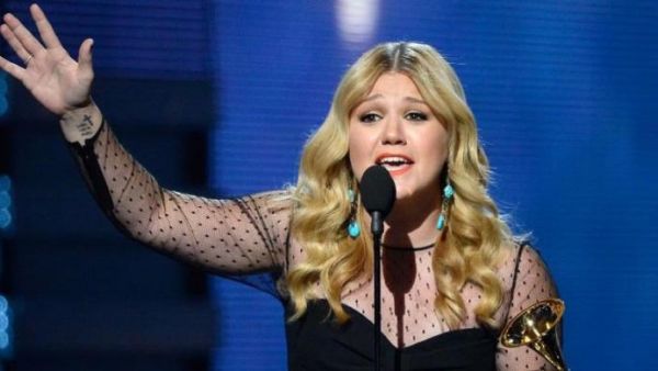 Kelly Clarkson reacts on stage as winning the Best Pop Vocal Album during the 55th Grammy Awards in Los Angeles. (AFP/File)