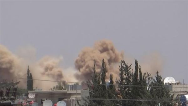 Screenshot taken from Youtube of Khan al-Shih being hit by barrel bombs. (YouTube) 