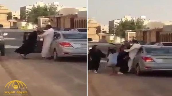 رجل يضرب فتاة وسط الشارع