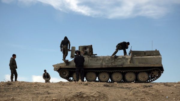 Fighters from the Syrian Democratic Forces (SDF) sit atop an armored personnel carrier in the northeastern Syrian province of Hasakeh, on February 19, 2016. (AFP/Delil Souleiman) Fighters from the Syrian Democratic Forces (SDF) sit atop an armored personnel carrier in the northeastern Syrian province of Hasakeh, on February 19, 2016. (AFP/Delil Souleiman)