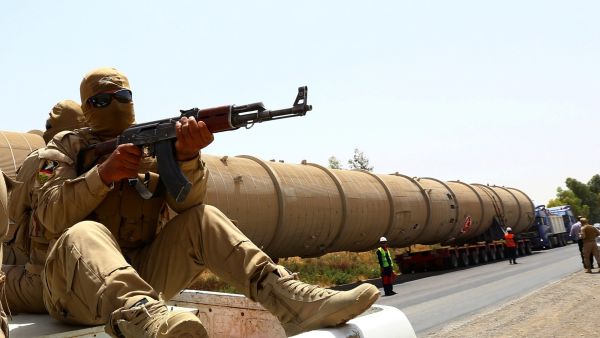 A guard at a Kurdish oil refinery. (AFP/Safin Hamed)