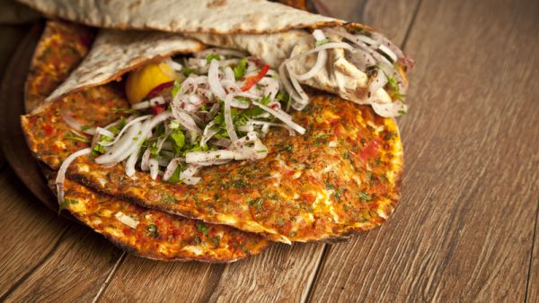 The latest culprit behind Middle Eastern diplomatic tensions: a lowly flatbread dish topped with minced meat and vegetables. (Shutterstock)