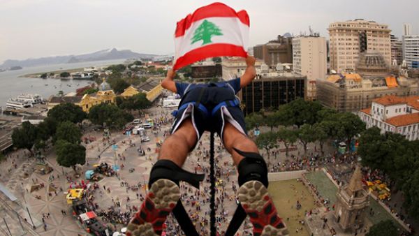 A Lebanon fan makes a bungee jump from a 45-meter-tall platform at Boulevard Olimpico, in Rio de Janeiro. (AFP/File) 