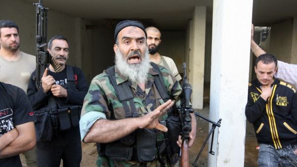 Sunni Salafist gunmen, who back the Syrian opposition, are seen in the northern Lebanese city of Tripoli on May 23 (AFP)