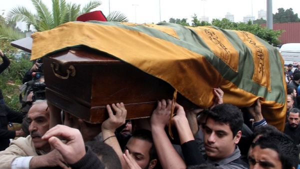 Relatives and friends carry the coffin of 16-year-old Lebanese Mohammad al-Chaar, who died in a bomb attack that killed former Lebanese finance minister Mohammad Chatah. [AFP]