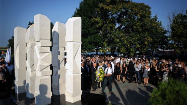 Relatives and officials pay respect on July 18, 2013 to a memorial dedicated to the five Israeli and one Bulgarian victims of a suicide blast which targeted on July 18, 2012 a bus of Israeli tourists at Burgas airport, southeast Bulgaria. A year after, Bulgaria is struggling to identify the attacker or confirm his suspected links to Hezbollah or Iran. (NIKOLAY DOYCHINOV/AFP/Getty Images) Relatives and officials pay respect on July 18, 2013 to a memorial dedicated to the five Israeli and one Bulgarian victims of a suicide blast which targeted on July 18, 2012 a bus of Israeli tourists at Burgas airport, southeast Bulgaria. A year after, Bulgaria is struggling to identify the attacker or confirm his suspected links to Hezbollah or Iran. (NIKOLAY DOYCHINOV/AFP/Getty Images)