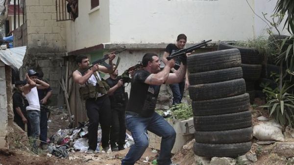 Gunmen fire during clashes between supporters and opponents of the Syrian government in northern Lebanon. [presstv]