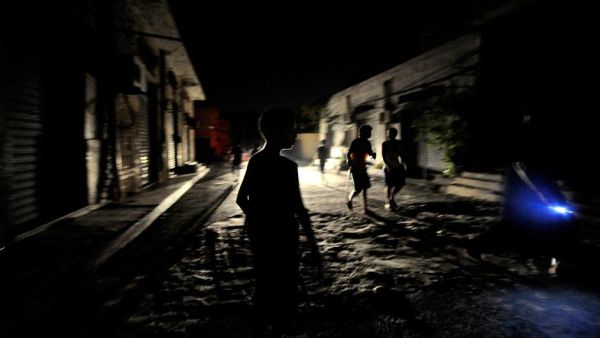 Young boys play outside at nighttime in Tripoli, Libya on August 22, 2011.  (AFP/Filippo Monteforte)