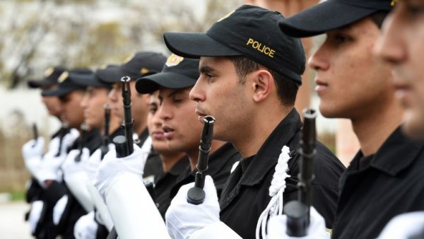 Tunisian police stand in line during a press conference held by Tunisia's Interior Minister Mohamed Gharsalli on March 26, 2015 in Tunis. (AFP/File)