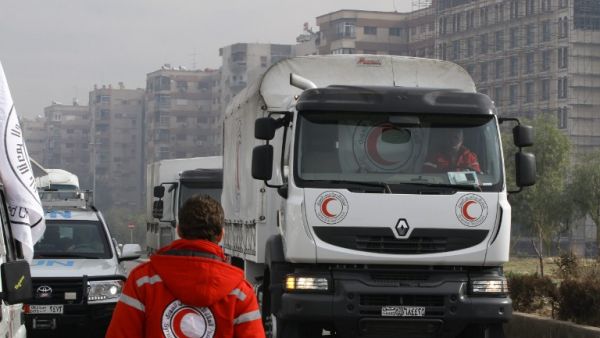 Aid convoys carrying food, medicine and blankets, leave the Syrian capital Damascus as they head to the besieged town of Madaya on January 11, 2015. (AFP/Louai Beshara)