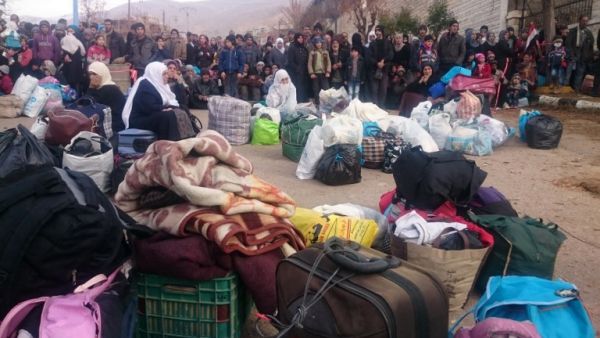 Residents of Madaya, one of Syria's besieged towns, are seen waiting to receive humanitarian aid. (File photo) Residents of Madaya, one of Syria's besieged towns, are seen waiting to receive humanitarian aid. (File photo)