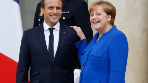 French President Emmanuel Macron (L) and German Chancellor Angela Merkel. (AFP/ File)