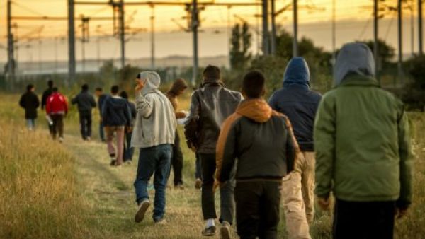The famed street artist seems to show up with reminders just when we need them, this time a piece showed up in Calais.  (AFP/File)