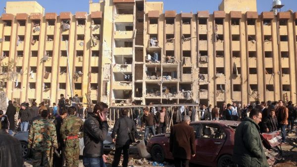 Syrian's gather at the scene of an explosion outside Aleppo University, between the university dormitories and the architecture faculty, on Tuesday. (AFP PHOTO/STR)