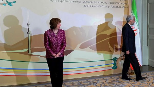 EU foreign policy chief Catherine Ashton (L) looks at Iran's top nuclear negotiator Saeed Jalili (R) leaving the podium after their meeting on the sidelines of the Iran's talks with world powers representatives on Iran's nuclear programme in the Kazakh city of Almaty. (AFP PHOTO /ILYAS OMAROV)