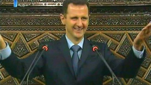 Assad during his speech. AFP