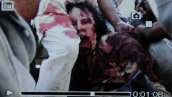 An image captured off a cellular phone camera shows the arrest of Libya's strongman Moammer Gaddafi.