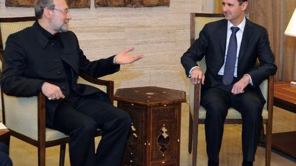 A handout picture released by the Syrian Arab News Agency (SANA) shows Syrian President Bashar al-Assad (R) meeting with Iranian Parliament Speaker Ali Larijani in Damascus. (AFP PHOTO/HO/SANA)