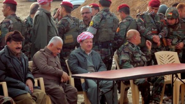 Massud Barzani, the president of Iraq's autonomous Kurdistan region (C-bottom) sits amidst Kurdish peshmerga security forces during a visit to the disputed north Iraq province of Kirkuk. (AFP PHOTO/MARWAN IBRAHIM)