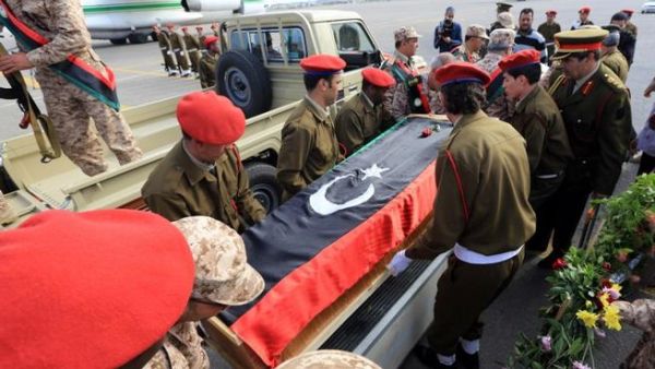 Libyan army soldiers carry the coffin of one of two soldiers killed in action in the oasis town of Bani Walid during a memorial service at Mitiga Airport, in Tripoli, on Sunday. (AFP PHOTO/MAHMUD TURKIA)