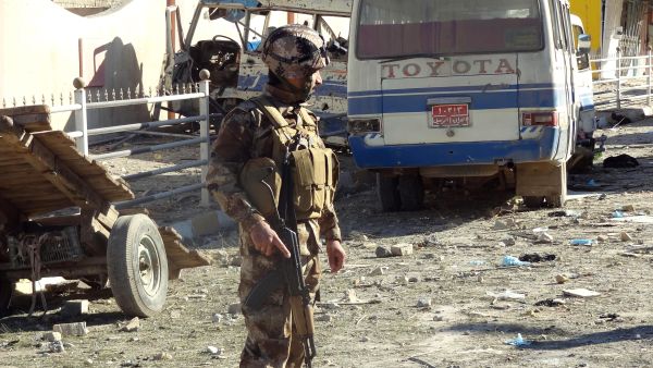 An Iraqi security officer inspects the site of an explosion on Wednesday in Kirkuk. (Marwan Ibrahim/AFP)